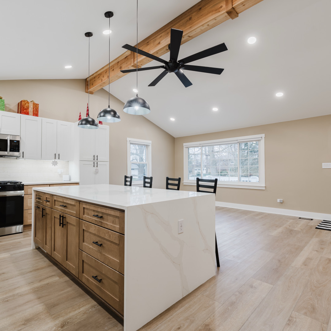 211 Roberts Road New Lenox, IL 60451 - Photo 6 of 37 a large kitchen with stainless steel appliances a large counter top a stove a sink dishwasher and a refrigerator with wooden floor