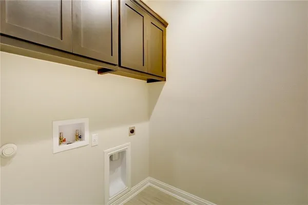 a view of storage and utility room with washer and dryer