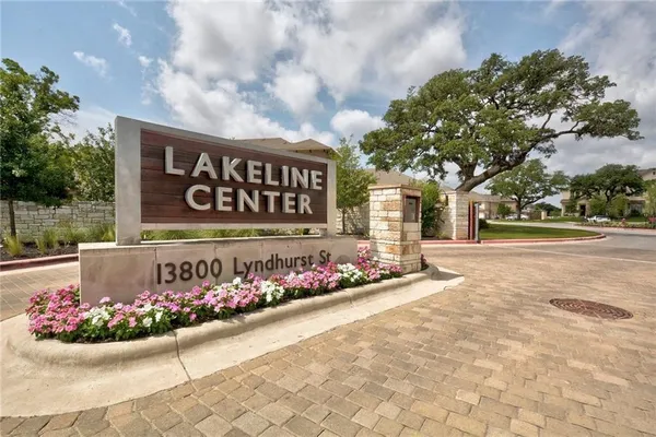 a sign that is in front of flowers