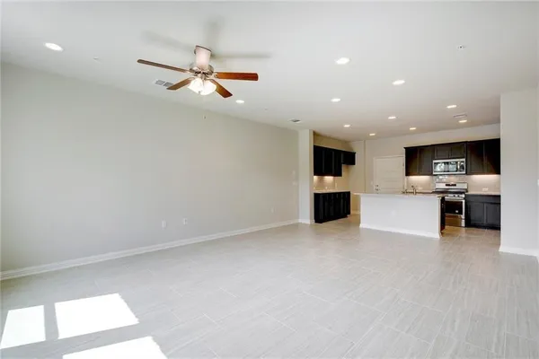 a view of a kitchen with a sink and a window