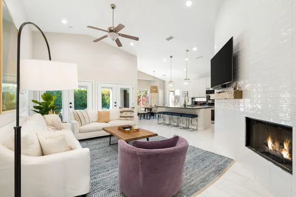 a living room with furniture and a large window