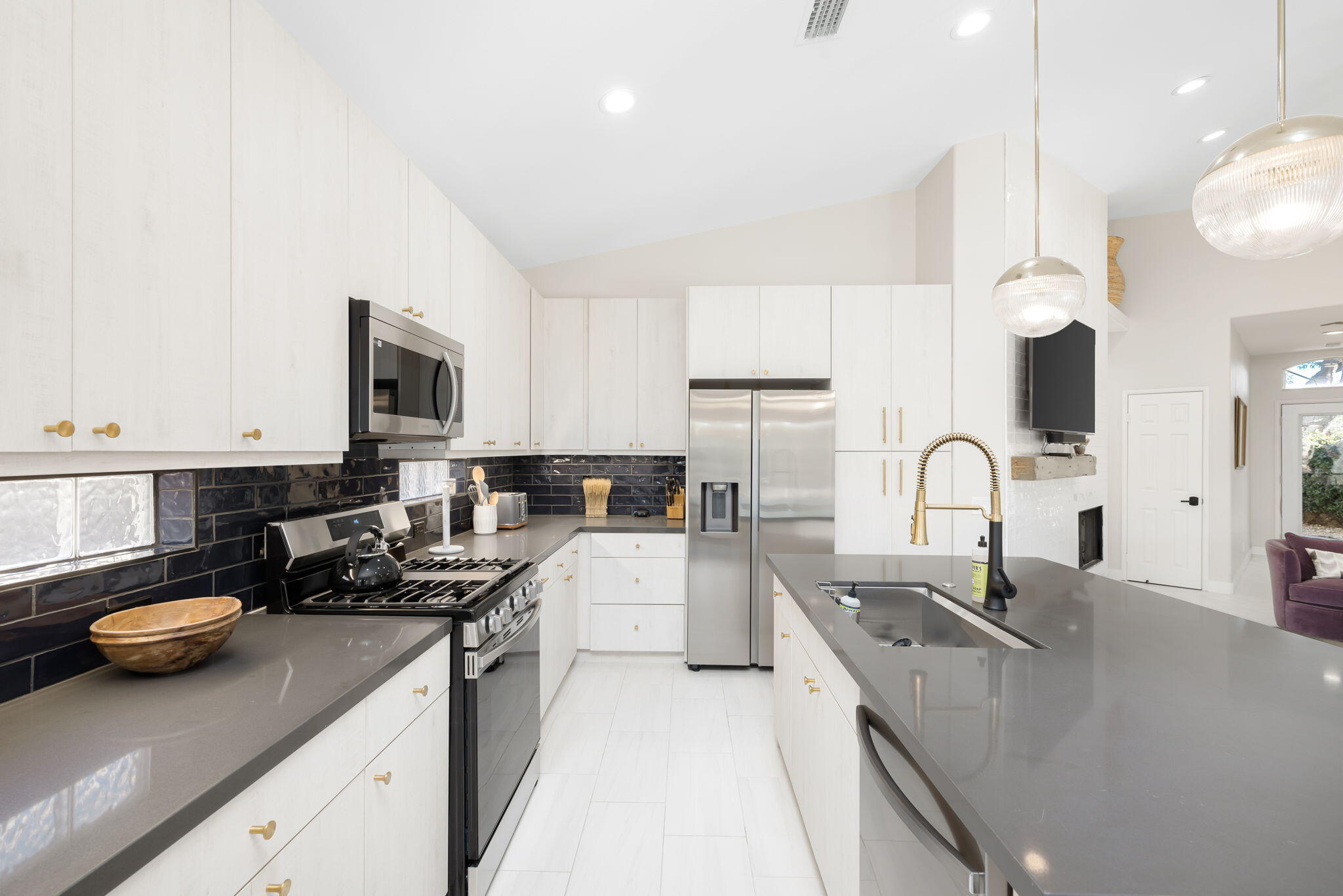 45809 Crosswater Street Indio, CA 92201 - Photo 21 of 48 a kitchen with sink a stove and cabinets