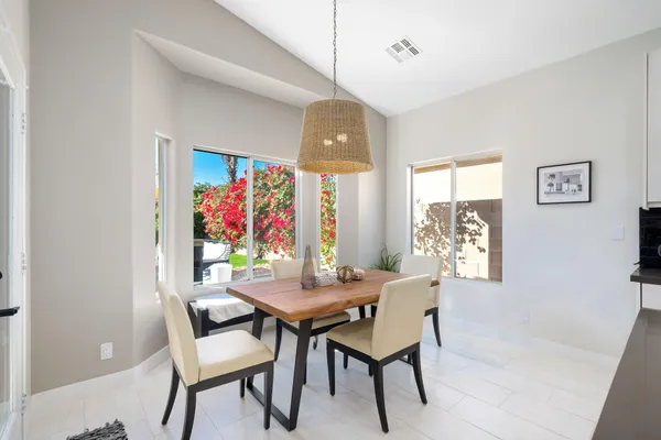 a view of a patio with a table chairs and a table