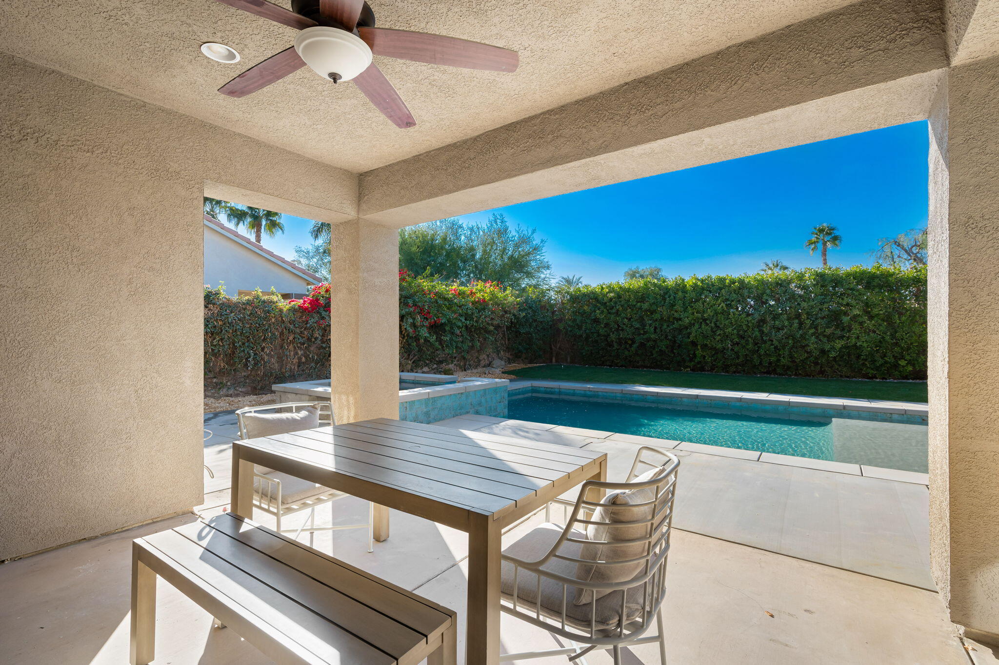45809 Crosswater Street Indio, CA 92201 - Photo 26 of 48 a view of a patio with a table chairs and a table