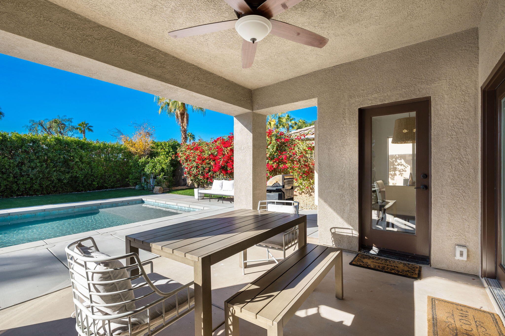 45809 Crosswater Street Indio, CA 92201 - Photo 27 of 48 a view of a dining room with furniture and a potted plant