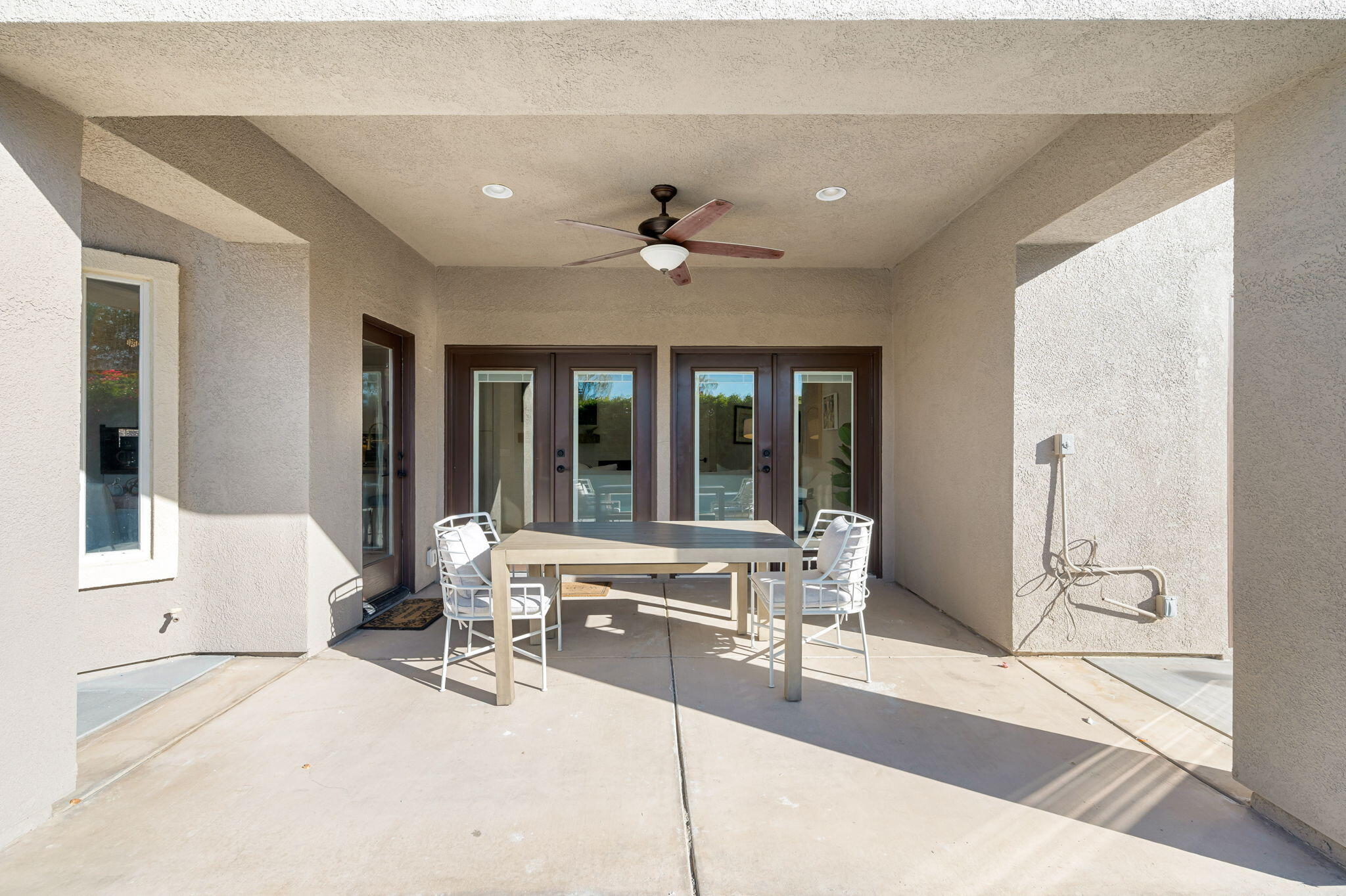 45809 Crosswater Street Indio, CA 92201 - Photo 28 of 48 a living room with furniture and large windows