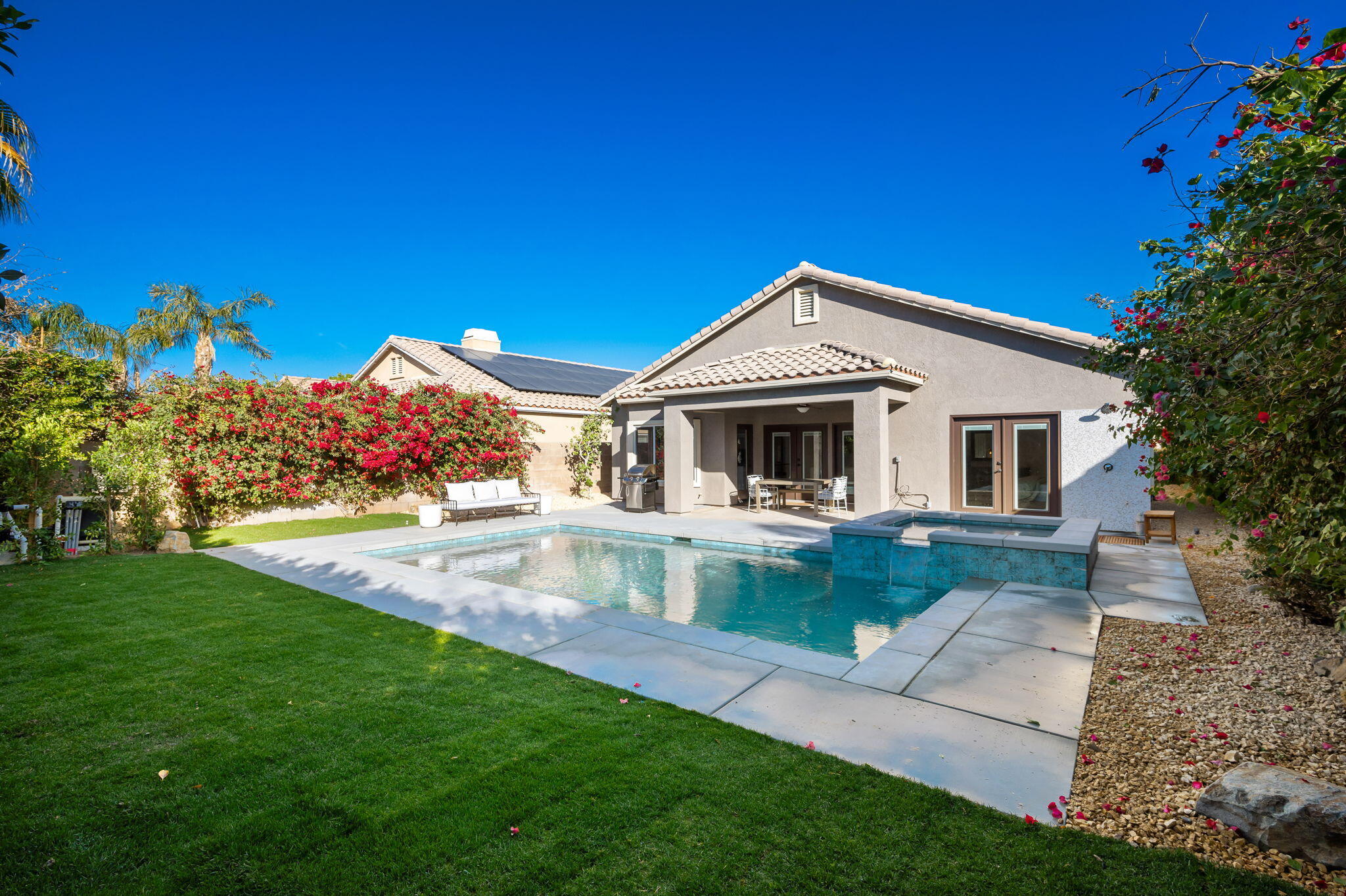 45809 Crosswater Street Indio, CA 92201 - Photo 33 of 48 a front view of a house with garden
