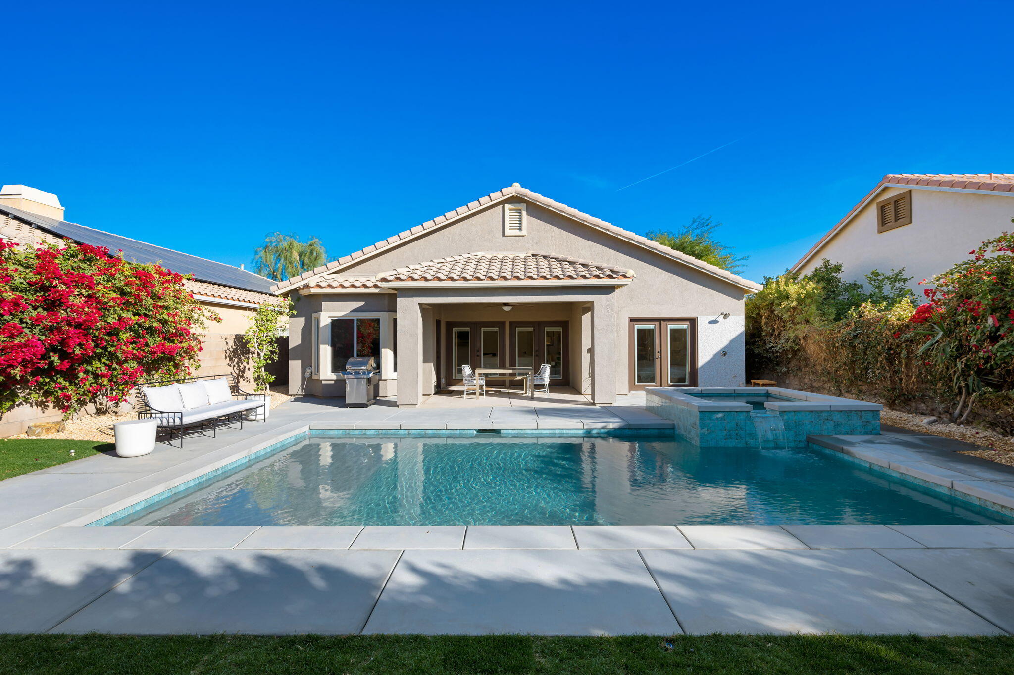 45809 Crosswater Street Indio, CA 92201 - Photo 34 of 48 a front view of a house with garden