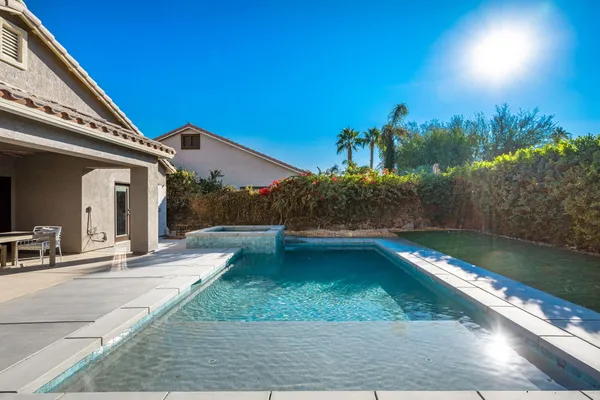 a view of swimming pool with chairs