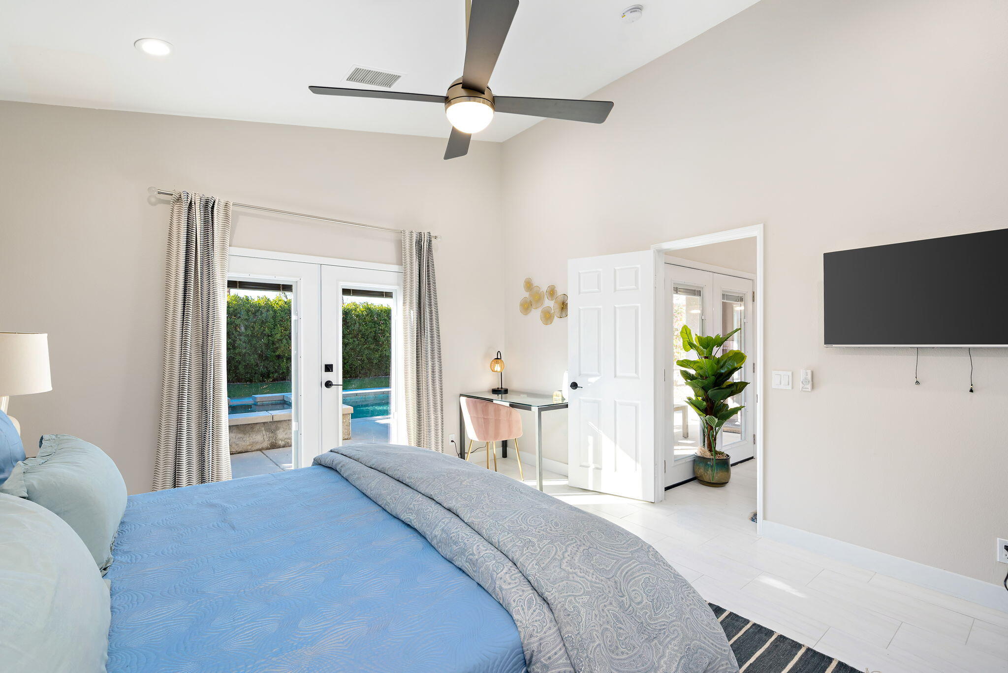 45809 Crosswater Street Indio, CA 92201 - Photo 40 of 48 a bedroom with a bed and a flat screen tv