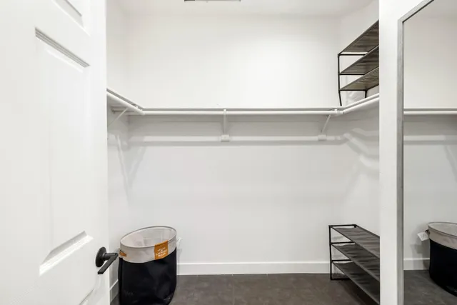 a view of kitchen with hallway and wooden floor
