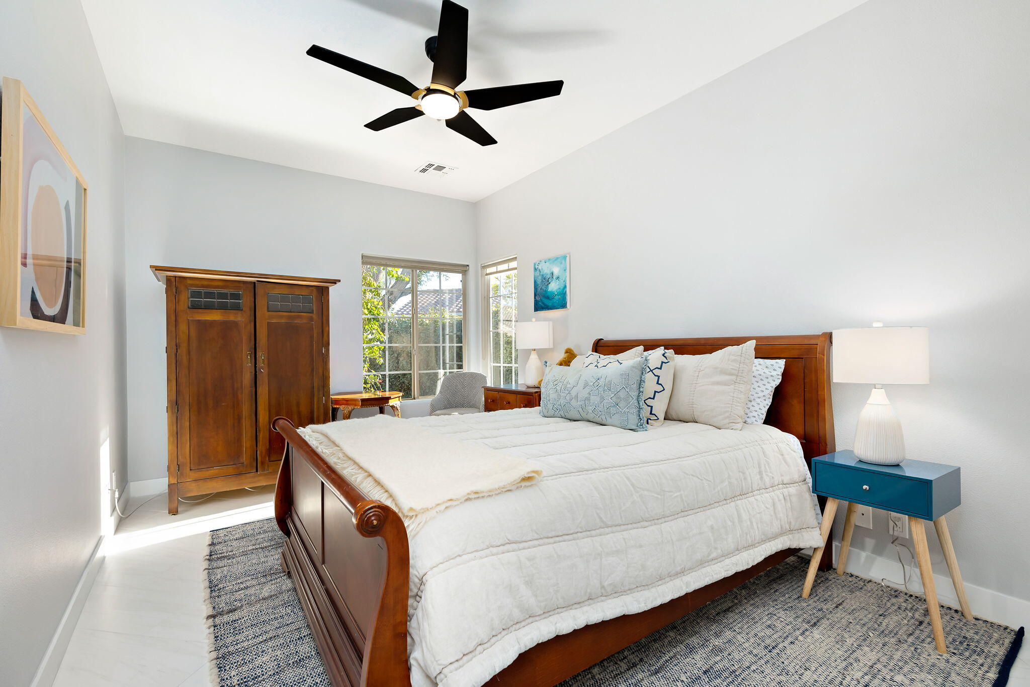 45809 Crosswater Street Indio, CA 92201 - Photo 47 of 48 a bedroom with a large bed and a chandelier