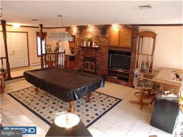 434 Pitman Road Sewell, NJ 08080 - Photo 8 of 17 a living room with furniture a flat screen tv and a table