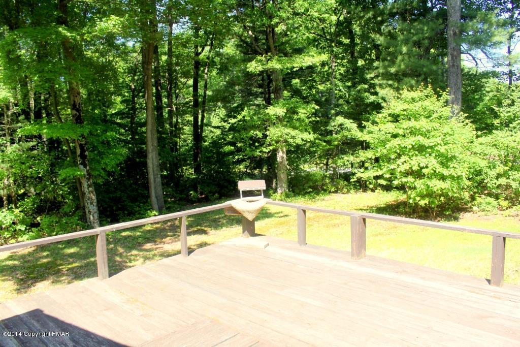 520 Gernerd Road Effort, PA 18330 - Photo 11 of 15 a view of a swimming pool with an outdoor seating and a forest