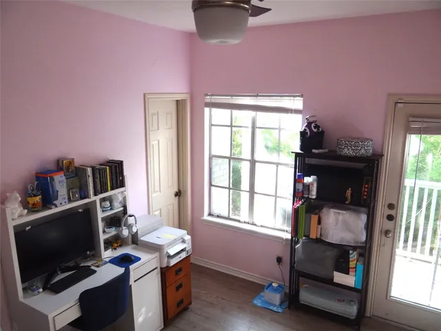 a bedroom with furniture and a window