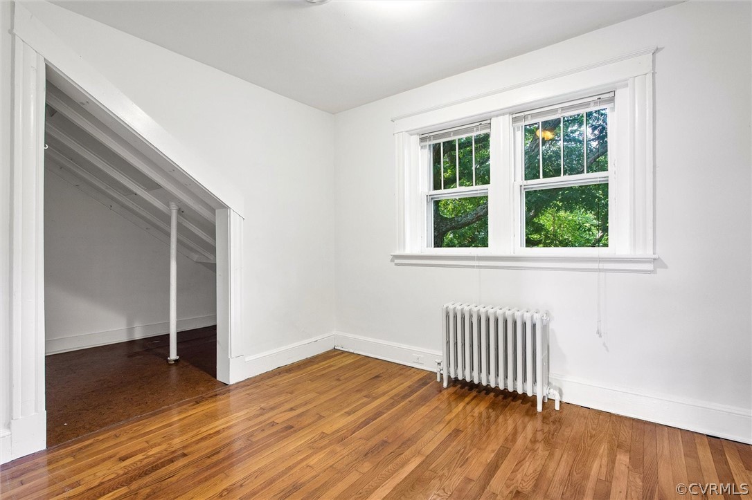 3417 West Hundred Road Chester, VA 23831 - Photo 15 of 23 an empty room with wooden floor and windows
