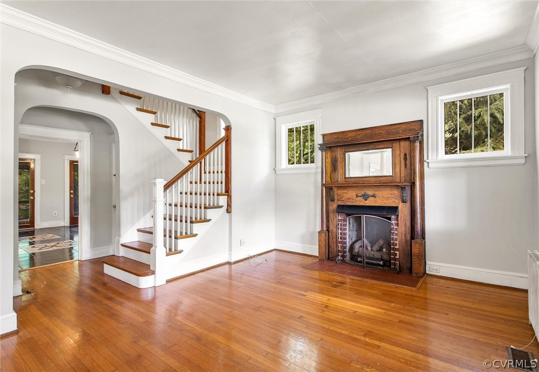 3417 West Hundred Road Chester, VA 23831 - Photo 3 of 23 a view of an empty room with wooden floor fireplace and a window