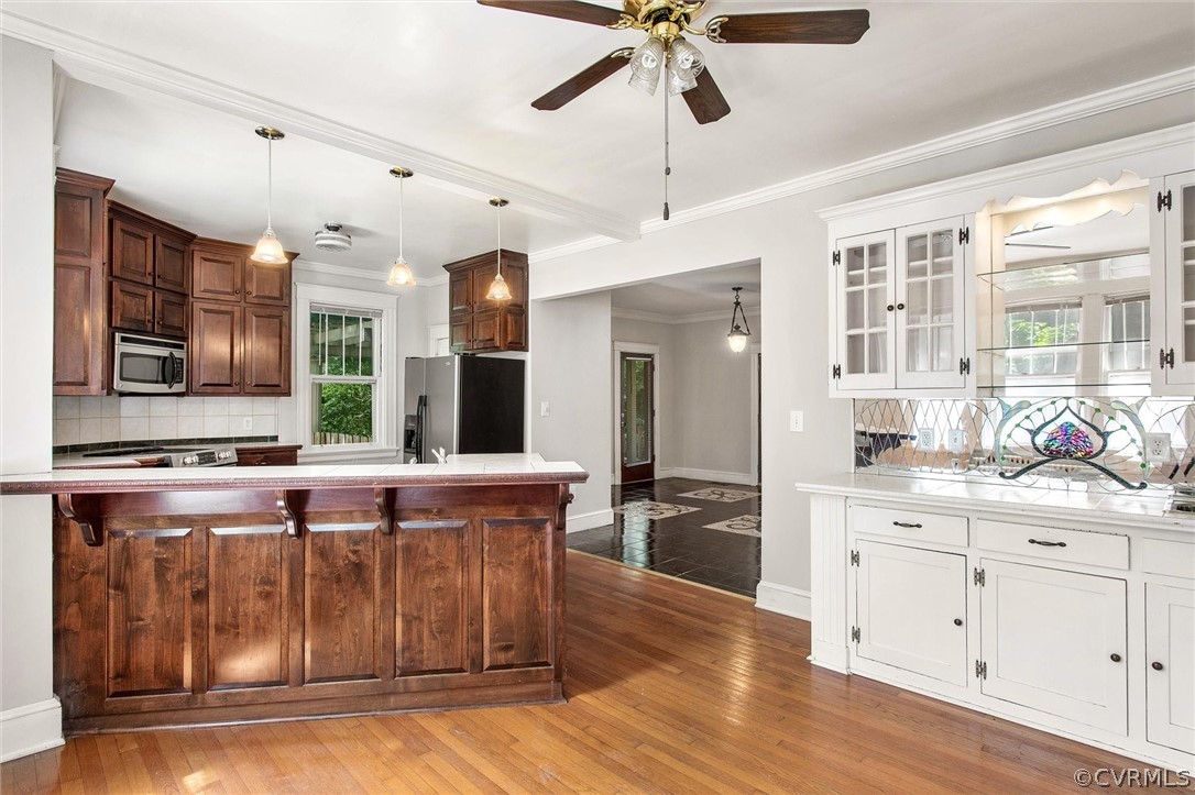 3417 West Hundred Road Chester, VA 23831 - Photo 7 of 23 a kitchen with stainless steel appliances granite countertop a stove and a wooden floors