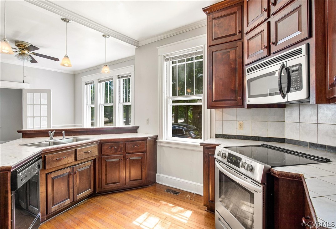 3417 West Hundred Road Chester, VA 23831 - Photo 8 of 23 a kitchen that has a sink and a stove in it