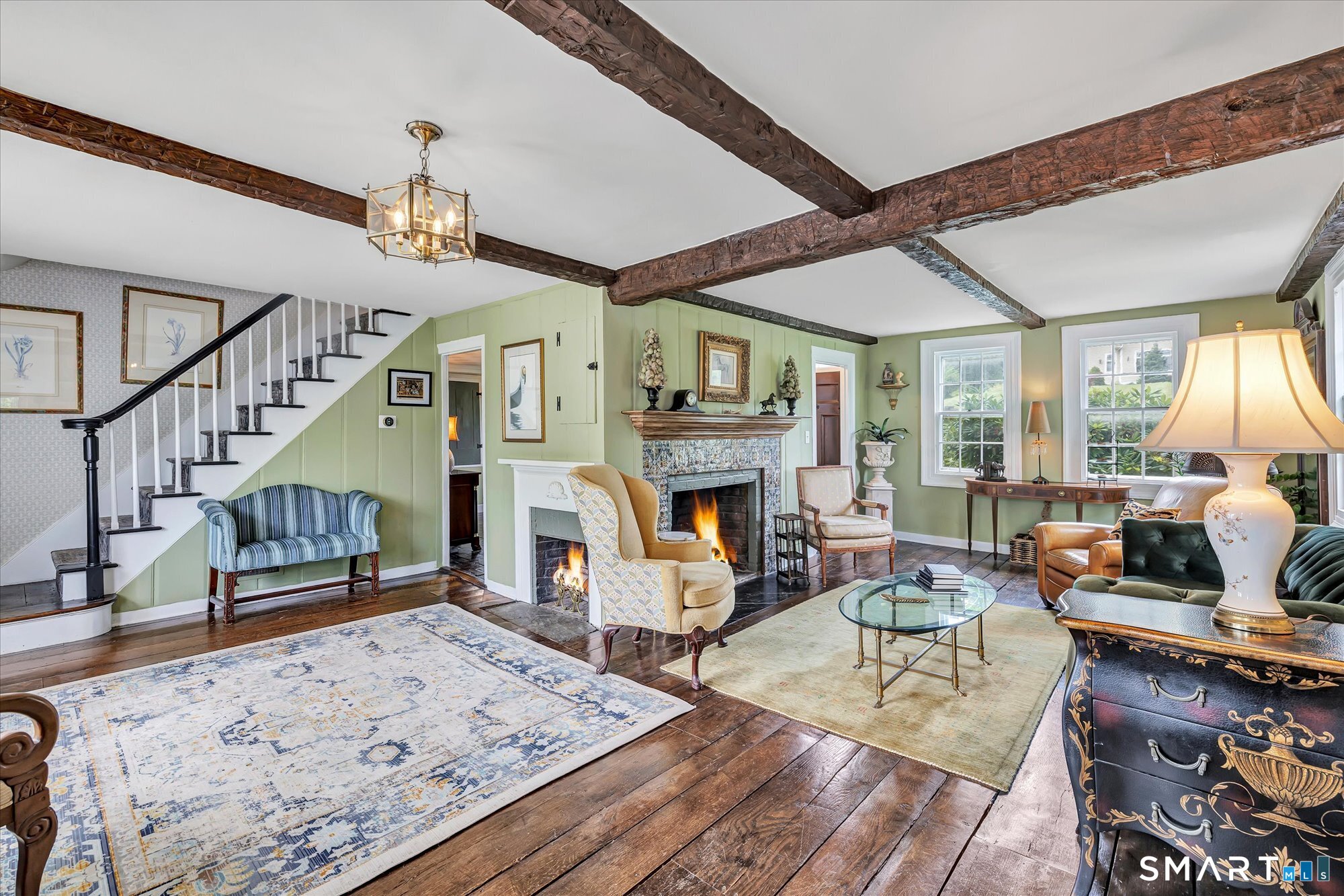 137 Rockwell Road Bethel, CT 06801 - Photo 7 of 40 ANOTHER VIEW OF LIVING ROOM WITH ORIGINAL 1760 BEAMS & A WOOD BURNING FIREPLACE