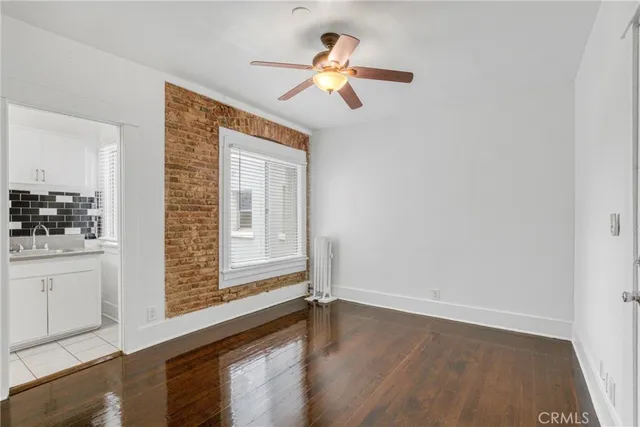 a kitchen with a sink and a refrigerator