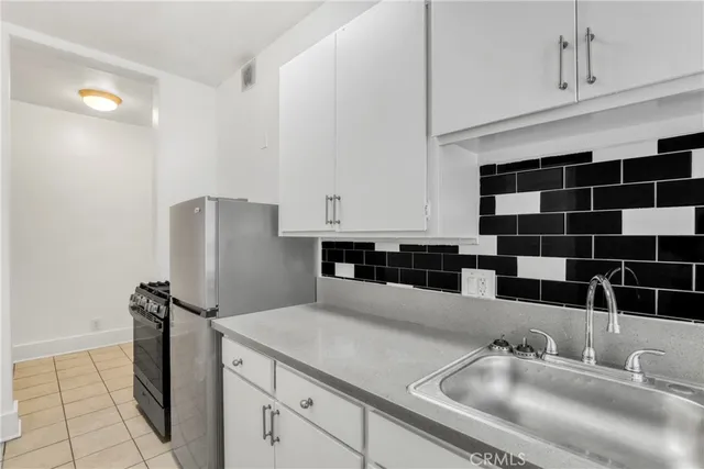 a bathroom with a sink mirror and toilet
