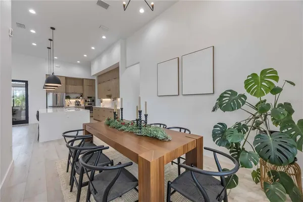 a spacious en suite bathroom with a double vanity sink a large mirror and a shower