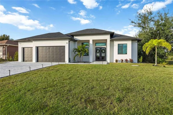 a front view of a house with a yard