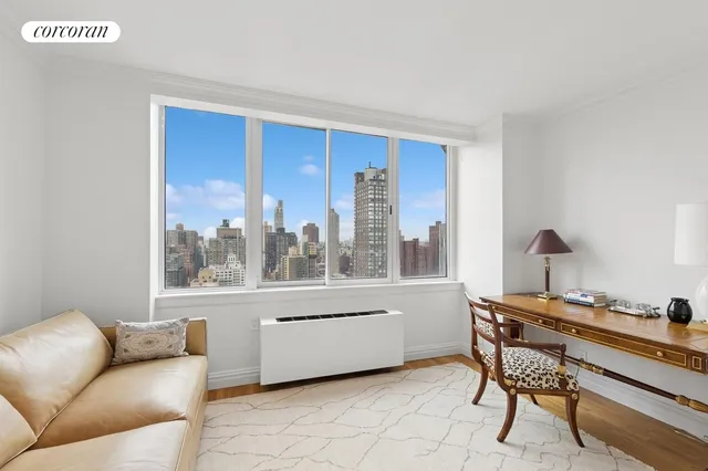 a bathroom with a toilet a sink a mirror and shower