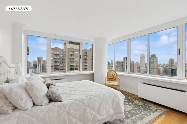 a bathroom with a granite countertop sink a toilet a mirror and bathtub