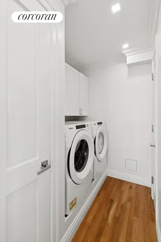 a large bed sitting in a bedroom next to a window