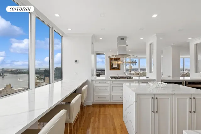 a large kitchen with a table and chairs