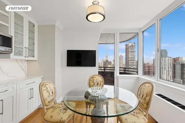 a kitchen with kitchen island granite countertop appliances cabinets and a sink