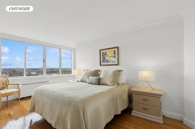 a dining room with furniture a window and wooden floor