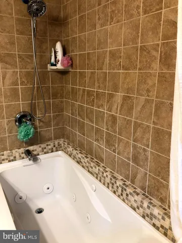 a bathroom with a bath tub
