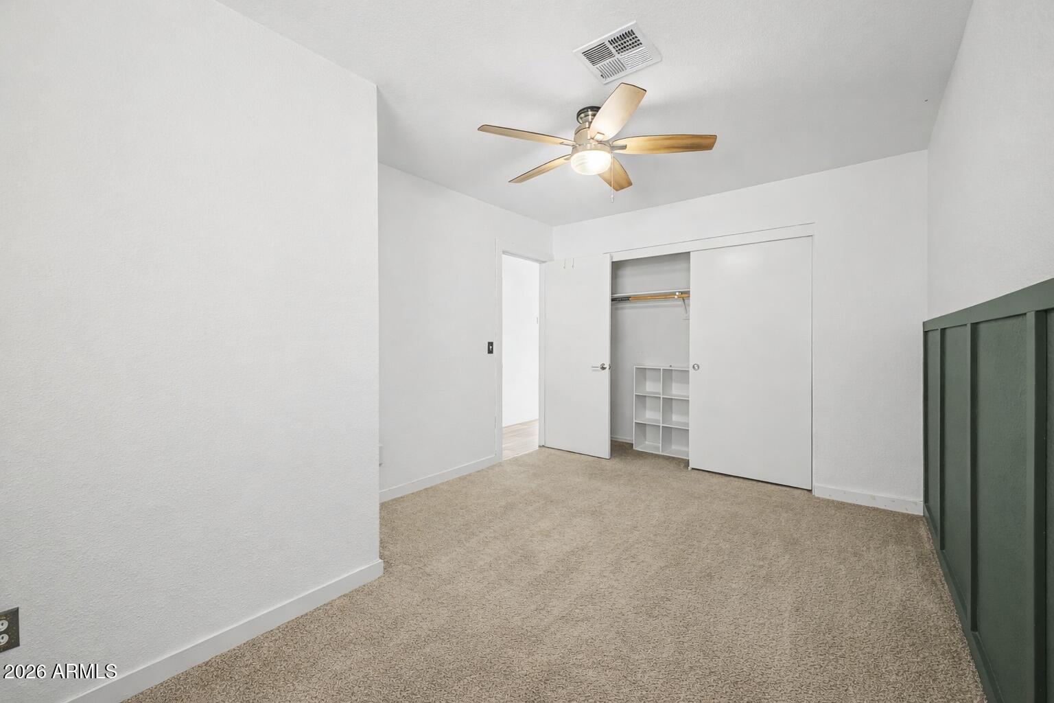 109 West Mohawk Lane Phoenix, AZ 85027 - Photo 11 of 23 a view of an empty room with a chandelier fan