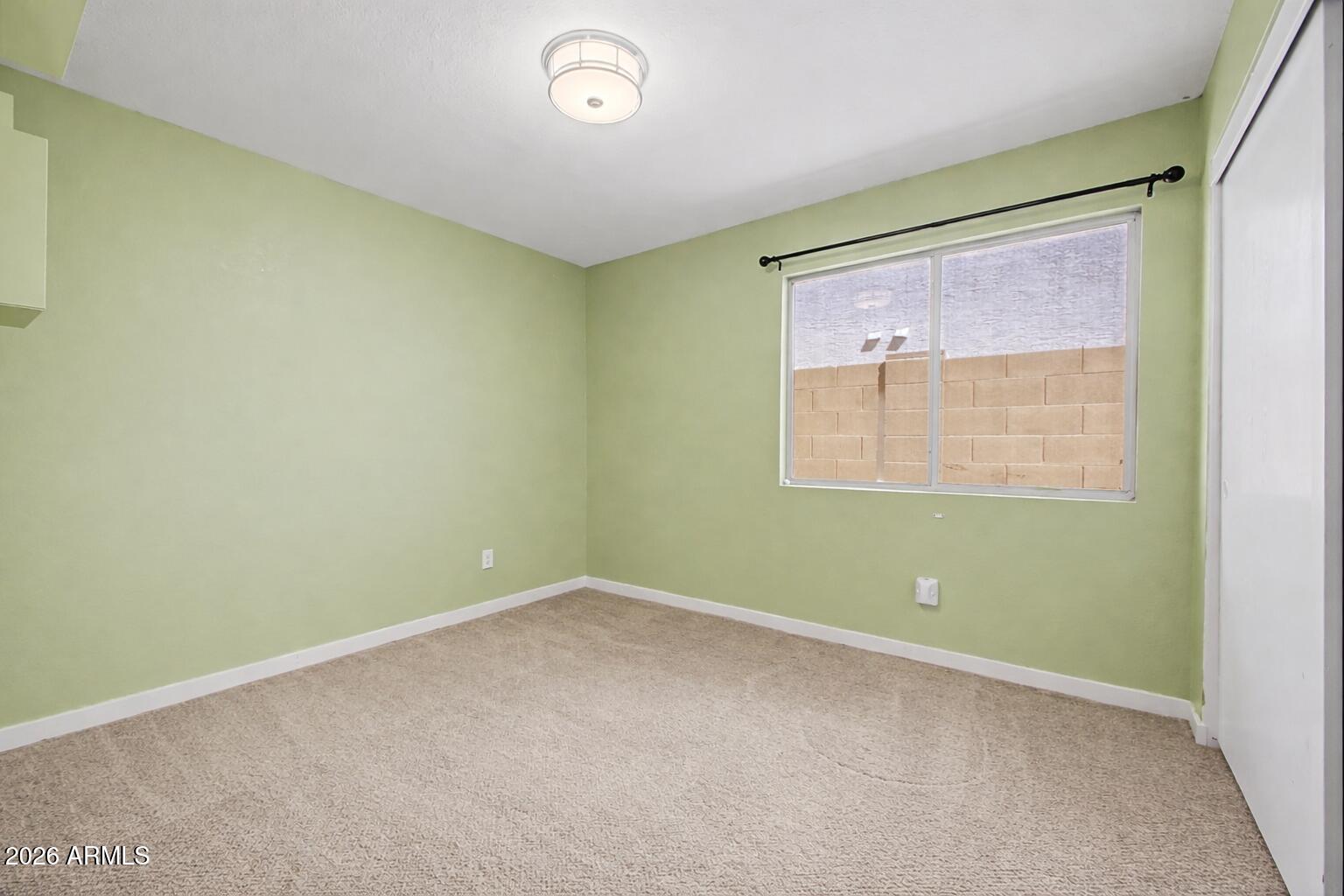 109 West Mohawk Lane Phoenix, AZ 85027 - Photo 13 of 23 an empty room with a window