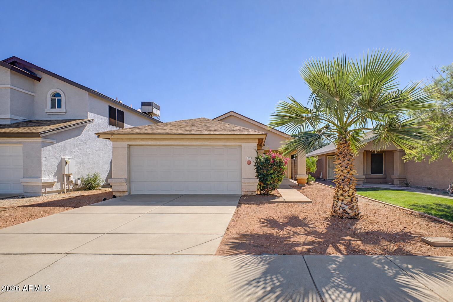 109 West Mohawk Lane Phoenix, AZ 85027 - Photo 20 of 23 a front view of a house with a yard and garage
