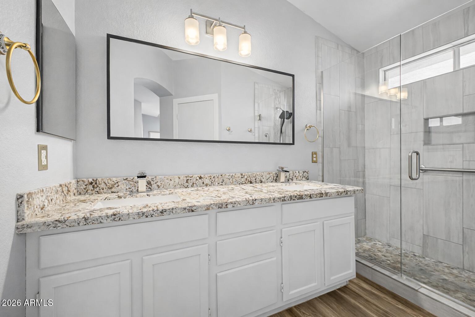 109 West Mohawk Lane Phoenix, AZ 85027 - Photo 4 of 23 a bathroom with a granite countertop sink and a mirror