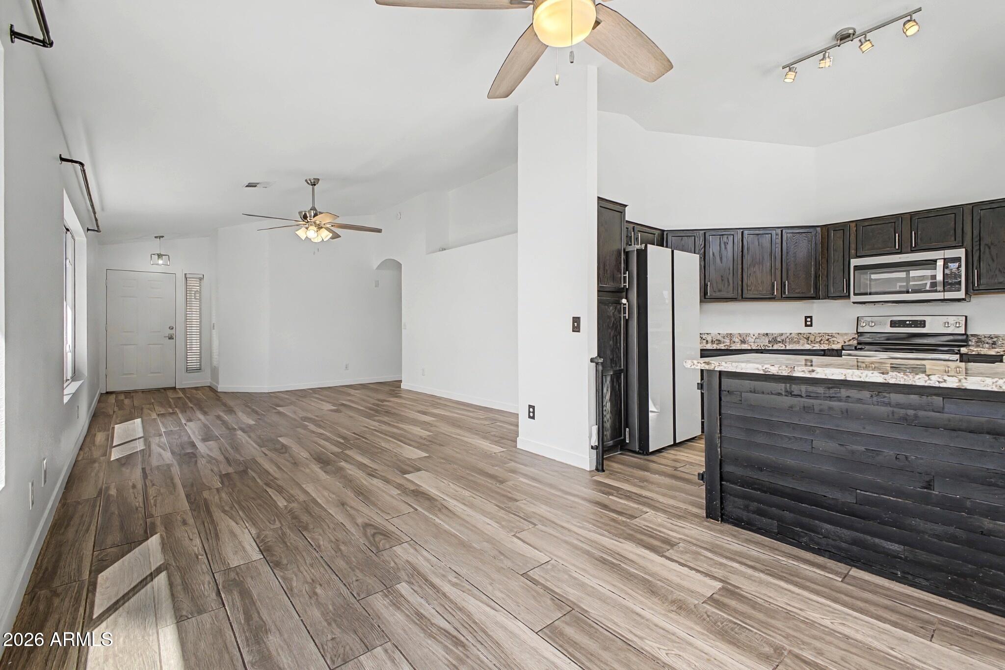 109 West Mohawk Lane Phoenix, AZ 85027 - Photo 6 of 23 a view of kitchen and empty room