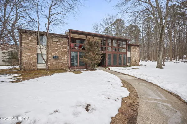 a view of a house with snow on the road