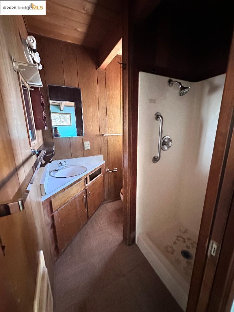 22071 Fallview Lane Sonora, CA 95370 - Photo 8 of 17 a bathroom with a sink a mirror and a shower