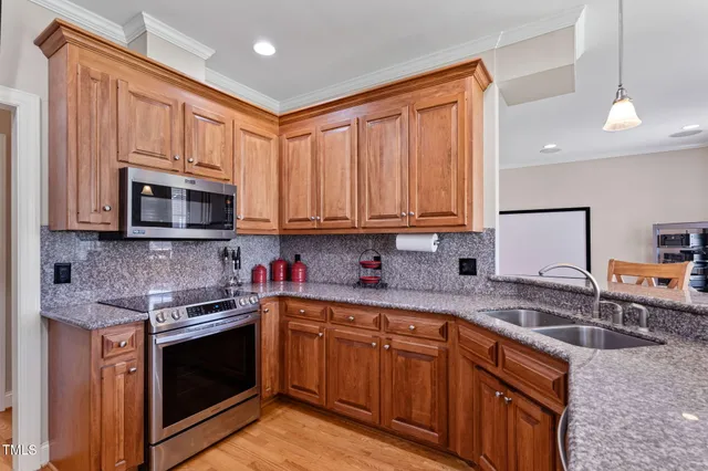 a work room with furniture and flat screen tv