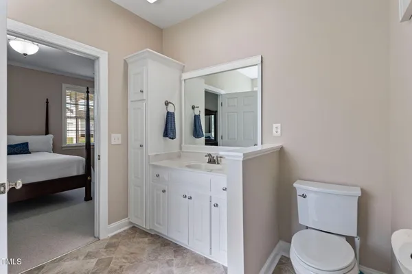 a bathroom with a sink a vanity and a mirror