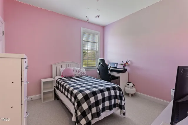 a living room with furniture and a ceiling fan