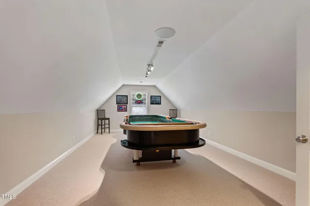 a view of a storage and utility room with washer and dryer