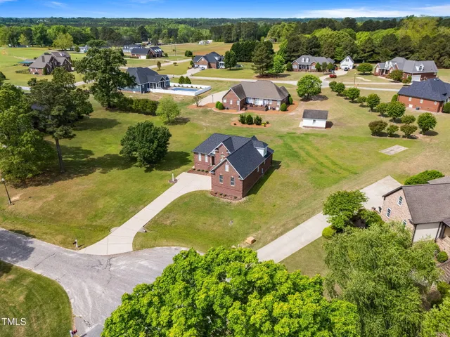 an aerial view of a house with a garden