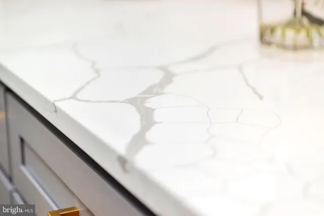 a kitchen with a sink window and cabinets