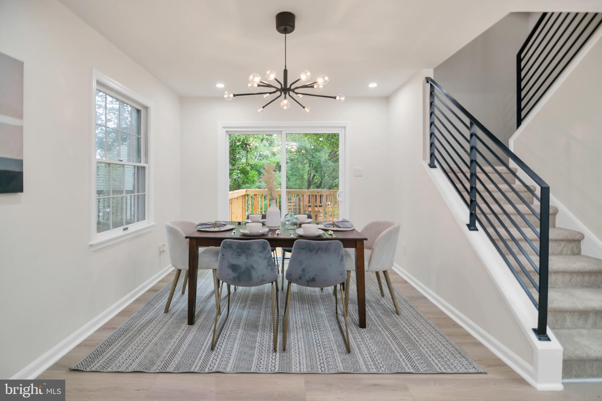 5809 Shana Place Burke, VA 22015 - Photo 17 of 46 a view of a dining room with furniture window and wooden floor