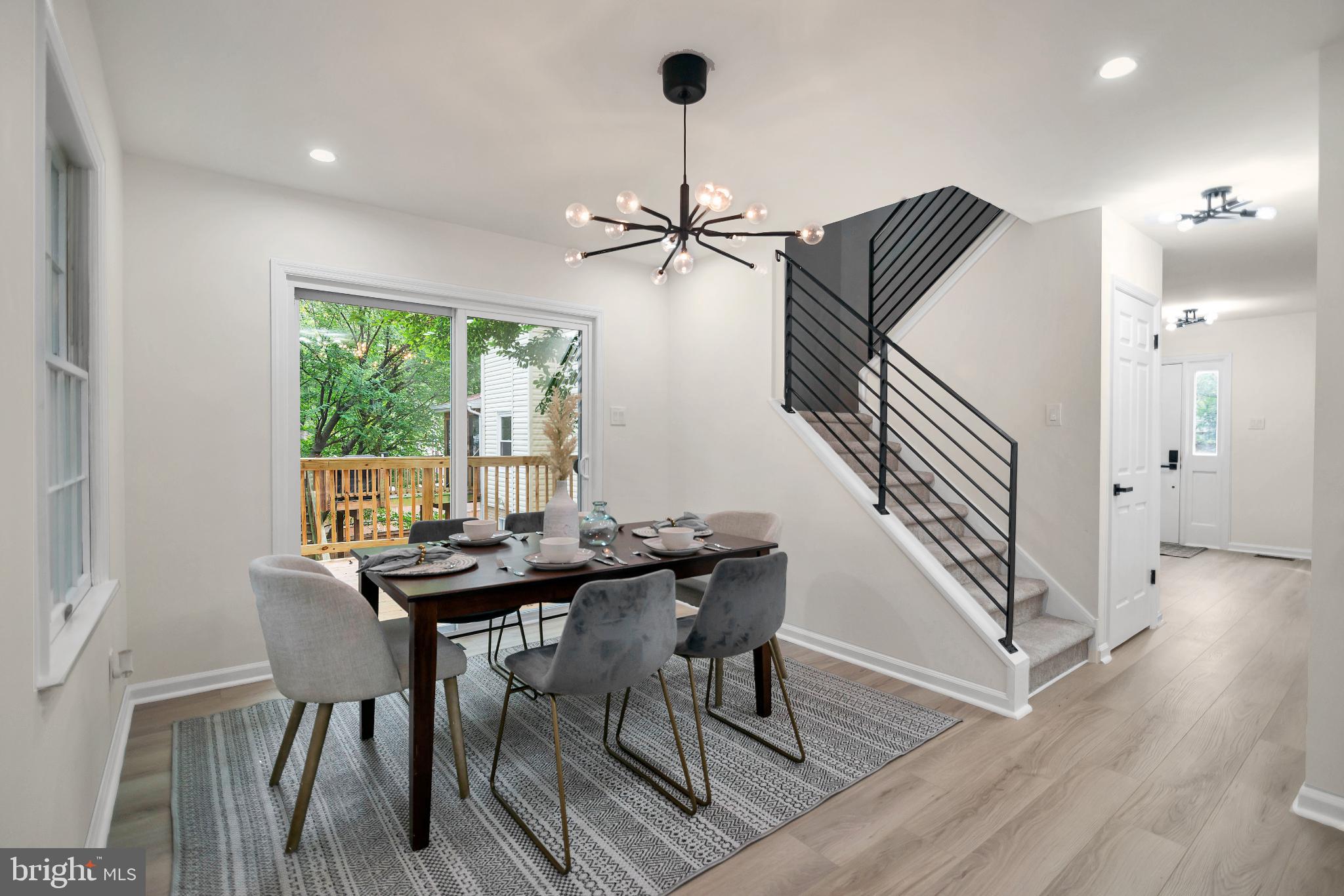 5809 Shana Place Burke, VA 22015 - Photo 18 of 46 a view of a dining room with furniture window and wooden floor